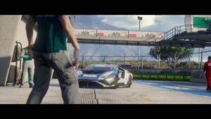 Race car rolling through the pitlane at Grand Senora Raceway with a pit crew member in the foreground